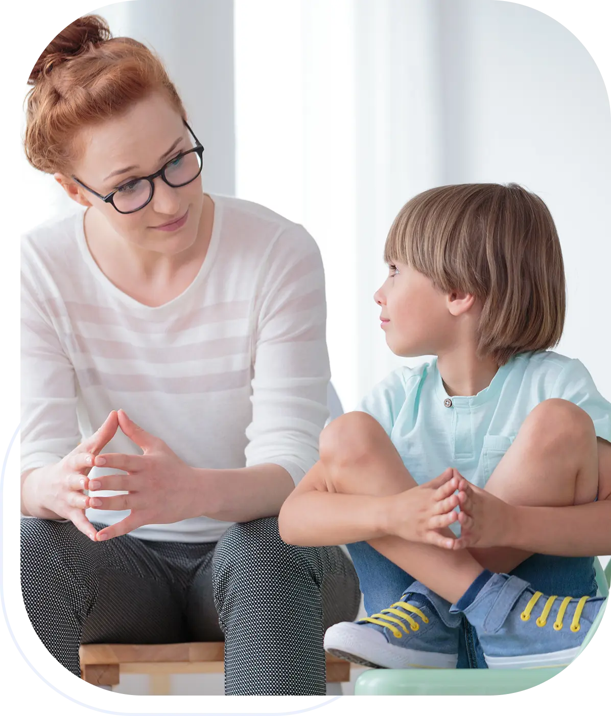 Woman and child sitting, having a conversation.